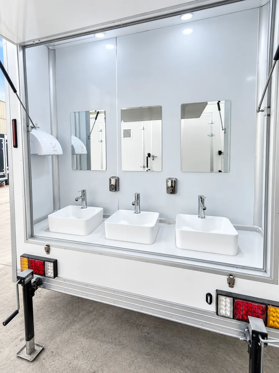 Commercial fixtures inside an emergency shower trailer rental