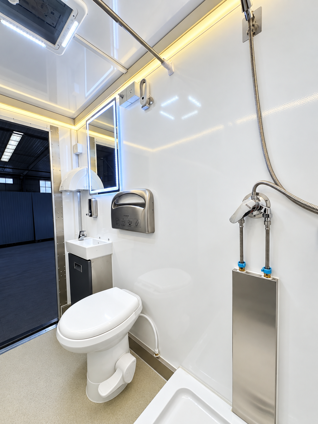 Interior reference from the client-supplied 3-stall plus 1 ADA shower and restroom combination trailer folder